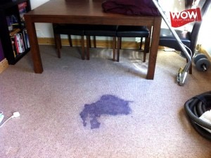 Red wine carpet stain before cleaning.